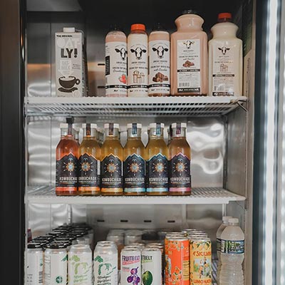 variety of cold beverages in fridge